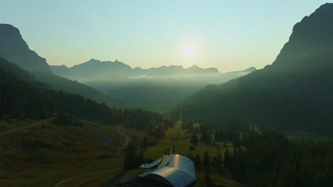 sunrise above alpine landscape with drone