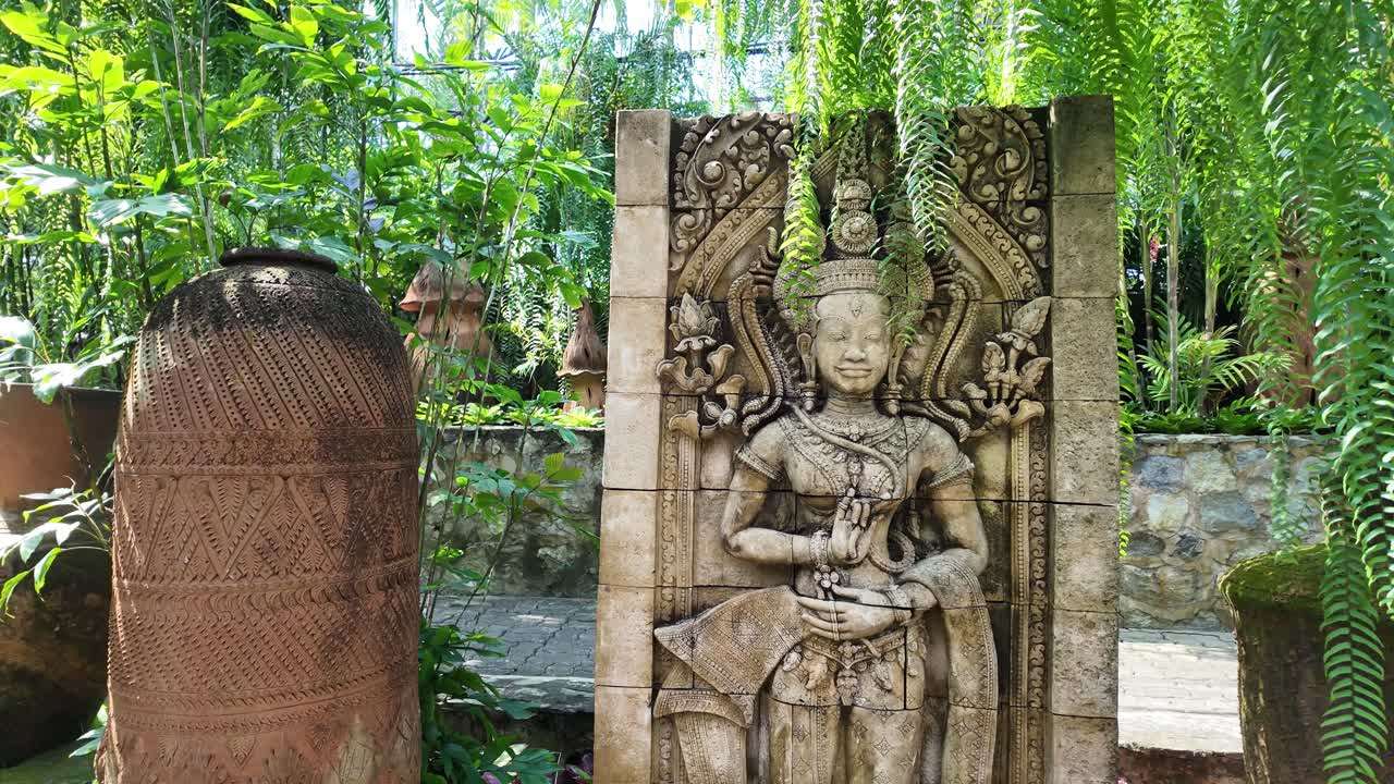 Apsara carving statue iconic buddha Pattaya Nong Nooch Botanical Garden Thailand