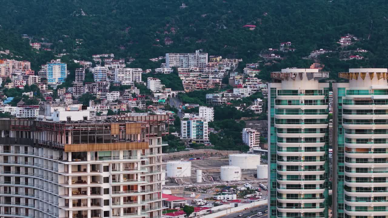 Revealing drone shot moving away from Acapulco city, Mexico