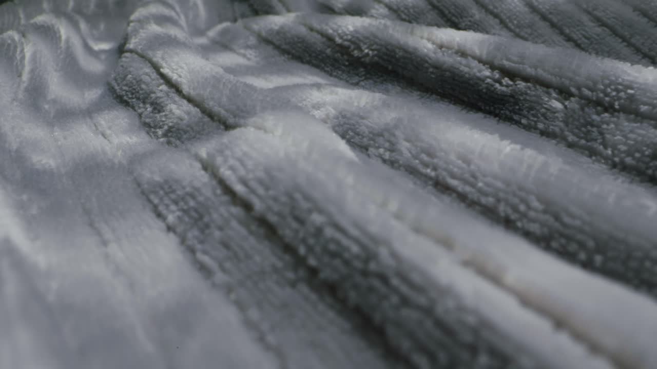 Closeup of an expertly tailored suit that beautifully showcases its sophisticated buttons and fine fabric texture