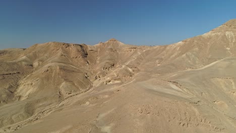 Aerial-footage-of-a-group-of-bicycle-riders-riding-on-bike-trails-in-the-desert