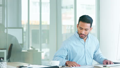 financial advisor sitting at a desk while typing