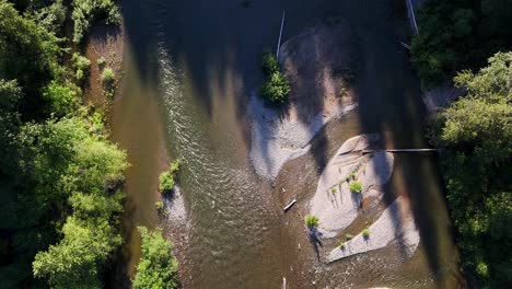 Scenic-Bird's-eye-shot-over-flowing-Tolt-River-in-green-forest-in-Washington-State