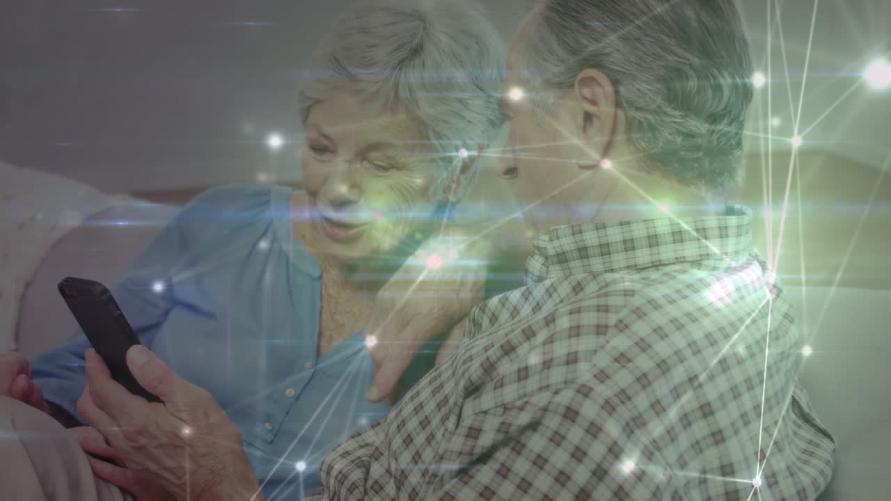 animación de la red de conexiones sobre una pareja caucásica con teléfono inteligente