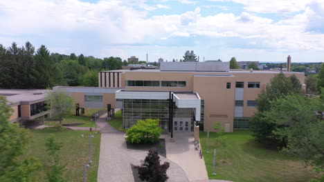 aerial: flying toward health sciences department building at université de moncton