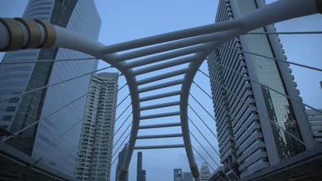 a vertical pan 4k video of early morning on chong nonsi skywalk, bangkok, thailand