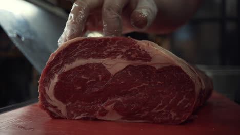 chef preparing a rib eye steak