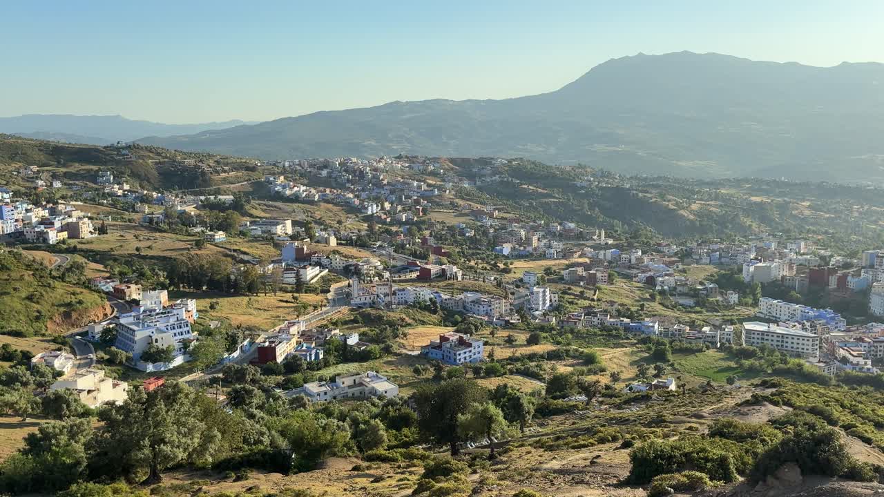 Houses around the Moroccan city of Chefchaouen at sunset