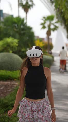 woman wearing vr headset in a park