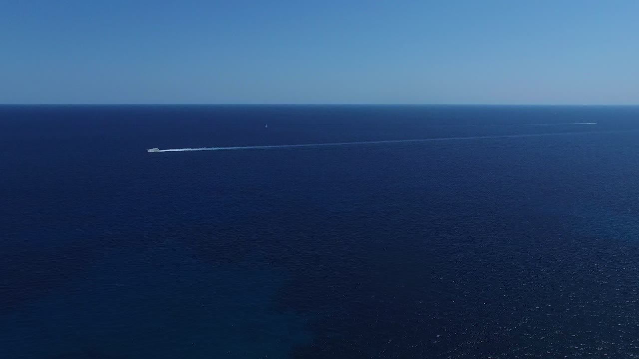 Aerial View of a Speedboat and Sailboat on the Ocean