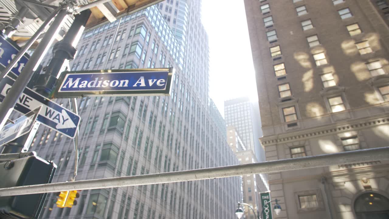 madison avenue sign on a sunny day, low angle shot, lens flare