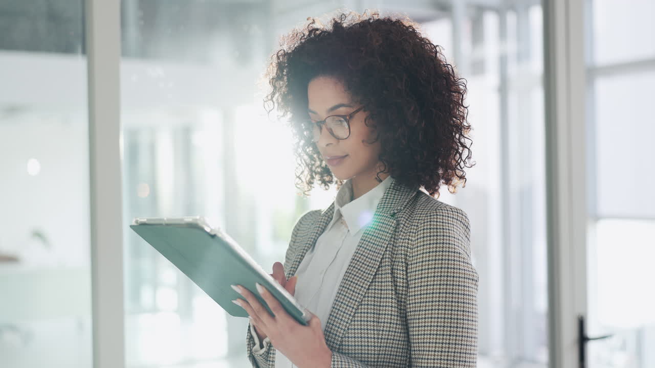 Businesswoman using tablet in office