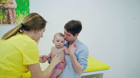mother with girl being examined by female pediatrician