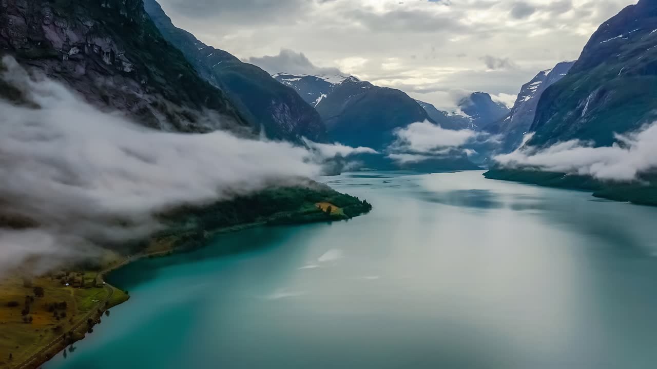 Beautiful Nature Norway natural landscape lovatnet lake flying over the clouds.