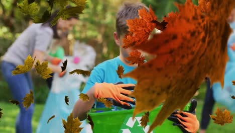 animation of leaves over caucasian volunteers cleaning park