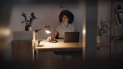 night, desk and a woman with headphones