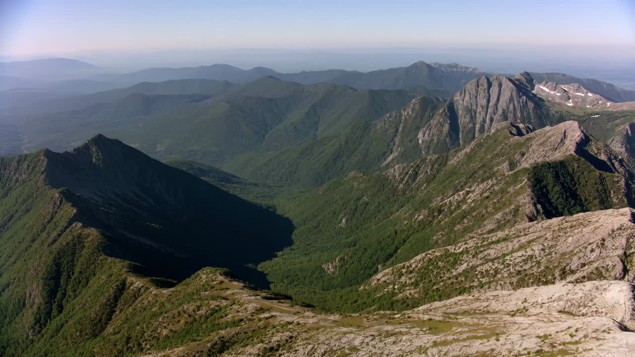Panoramic View of Lush Green Mountain Range and Valley