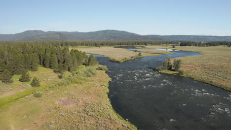 high fly over drone footage over henry's fork river in southeastern idaho, usa