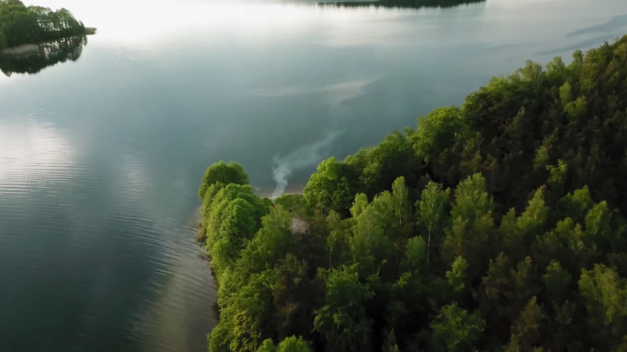 Aerial view of grill smoke at the shore of wdzydze lake in Poland