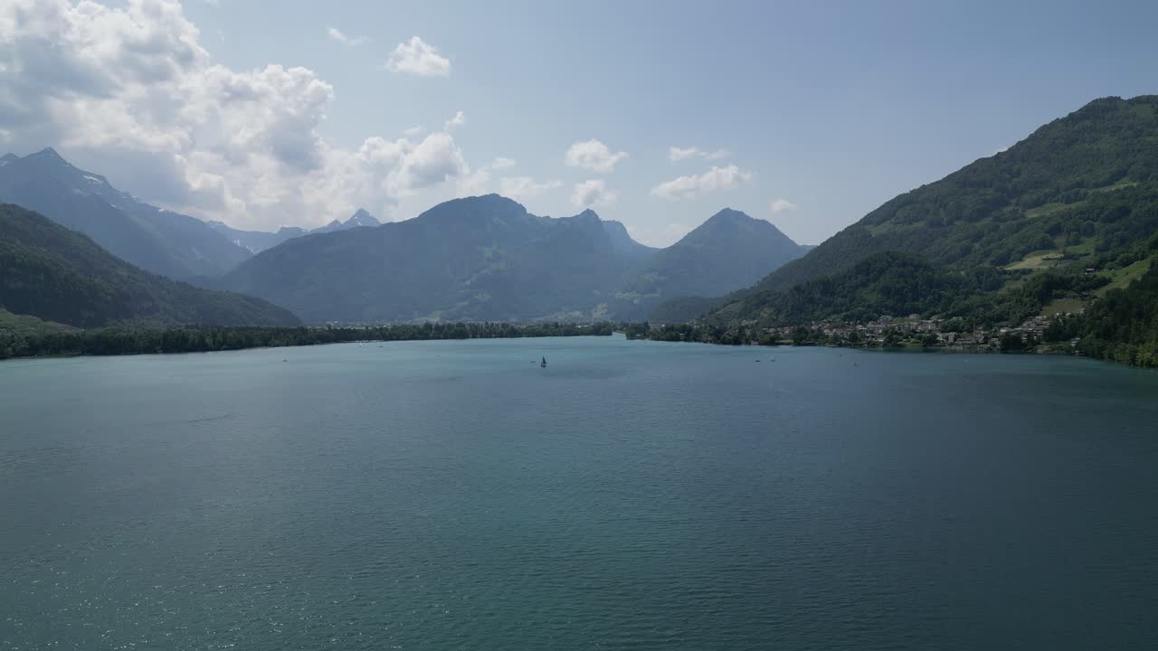 Sailing boat on the lake in G&auml;si Betlis, Walensee Glarus, Weesen Walenstadt, Switzerland- drone view