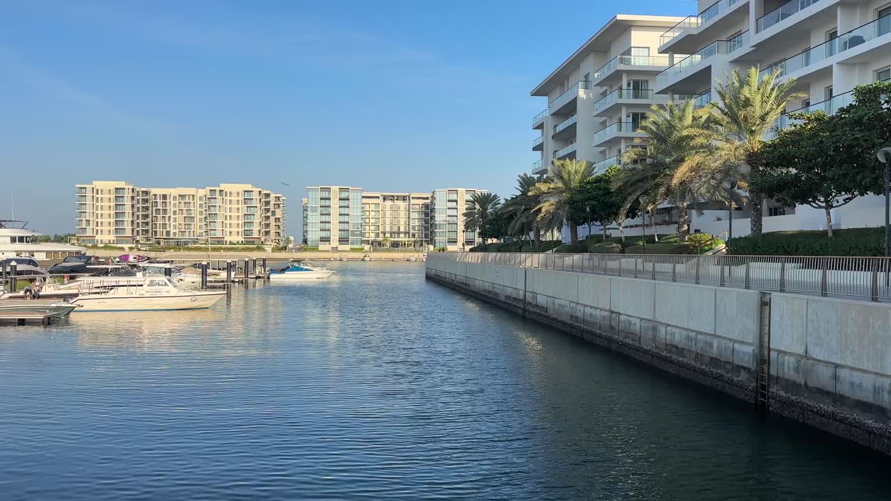 Al Mouj Marina Muscat Oman With Yachts, Waterfront Walkway and Modern Coastal Development