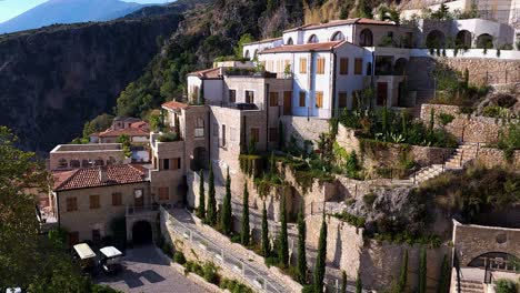 beautiful resort nestled in an albanian village with stone walls, offering breathtaking overlooks of the tranquil ionian sea