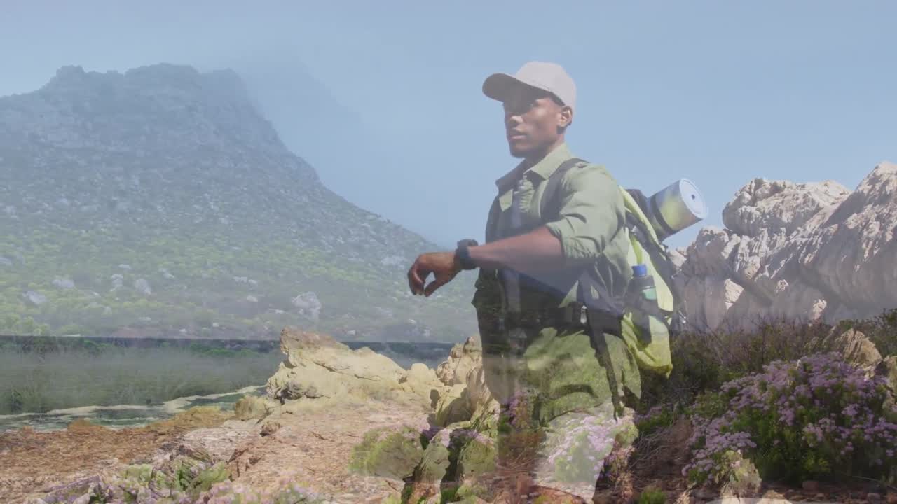 animación del paisaje sobre hombre afroamericano en las montañas
