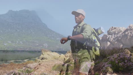 animación del paisaje sobre hombre afroamericano en las montañas