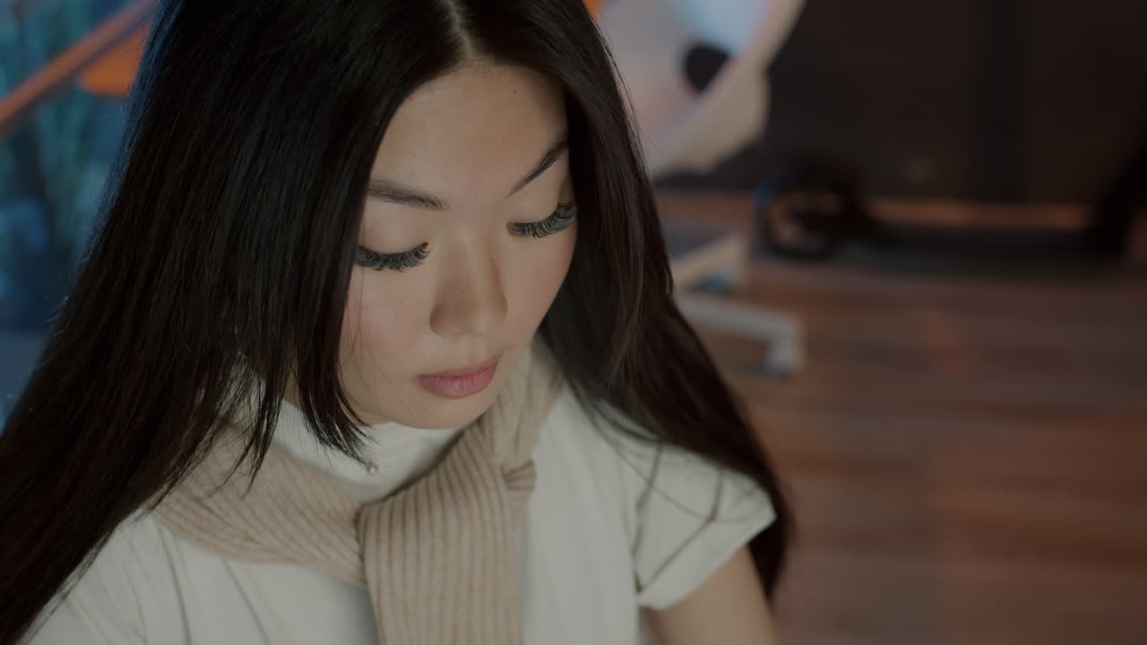 Young Woman Studying or Working at a Desk
