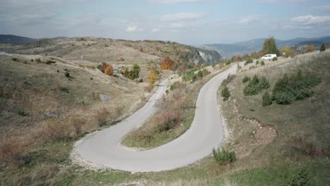 van driving through the fall colors all around slovenia's durmitor national park