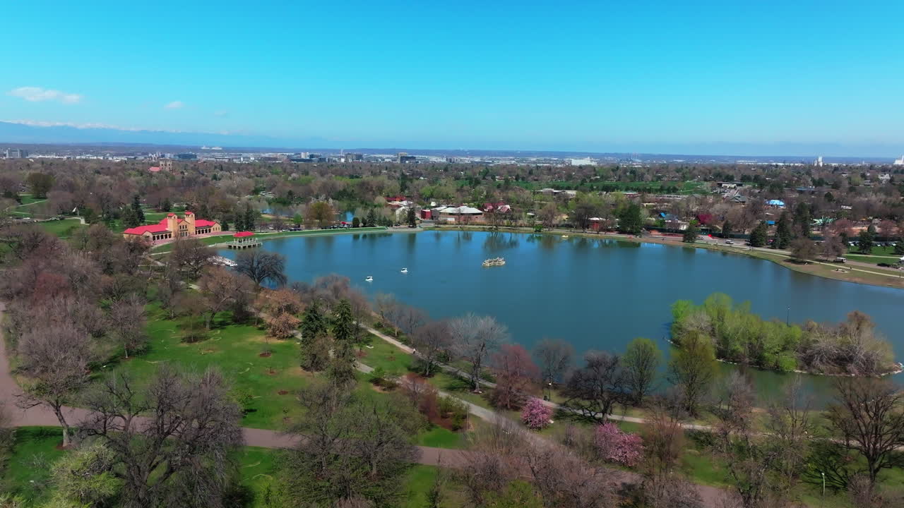 Ferril Lake Denver Zoo City Park Golf Course spring downtown cityscape aerial drone Colorado green lush grass sunny blue skies morning neighborhood city landscape upwards motion
