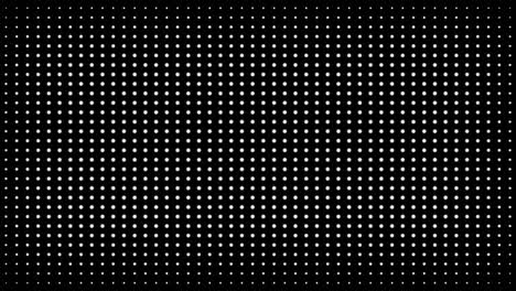 white polka dots against black background. concentric growing circles seamless loop transition