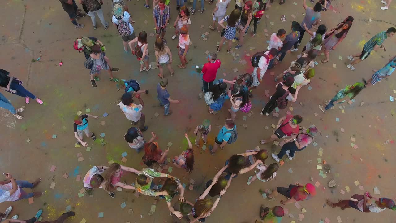 Summer Outdoor Festival. VINNITSA, UKRAINE - JULY 2017: Young people covered with coloured powder during summer outdoor festival