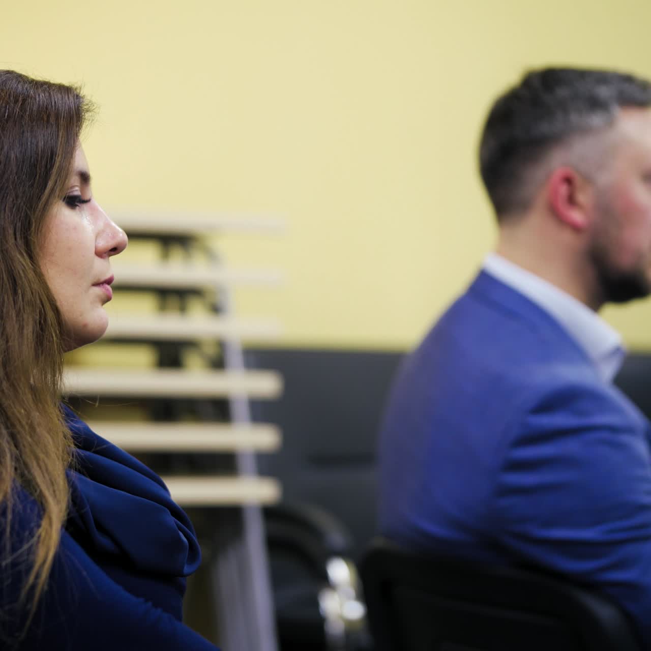 Attendees at an indoor meeting or conference