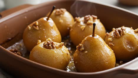 warm baked pears with walnuts in a baking dish