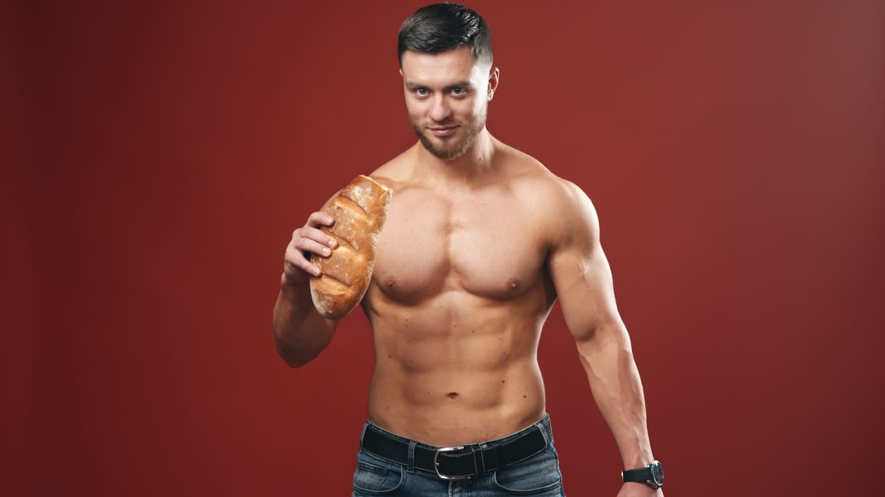 Muscled male model in studio. Muscular strong athlete demonstarting his body