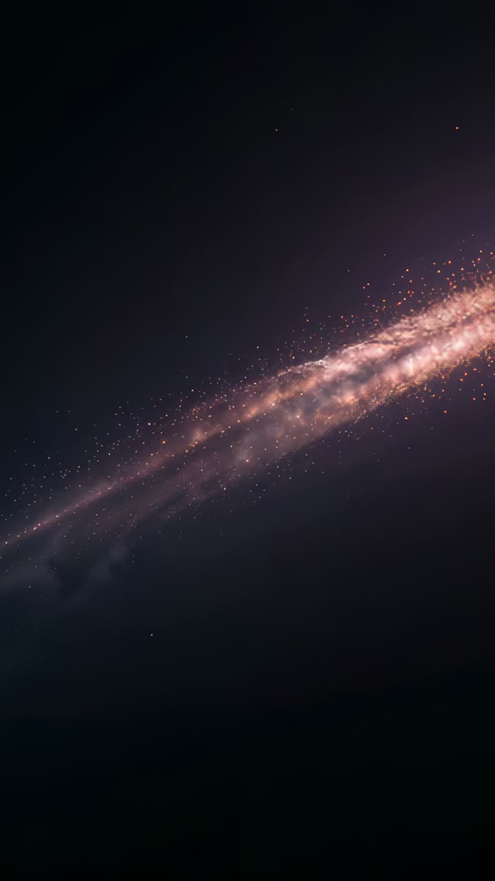 Vertical video: Bursting meteoric fireball streaking across star stream in space, with orange trail