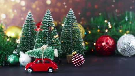 decoración de invierno de navidad con luces parpadeantes, árboles de navidad y coche rojo con árbol en el techo