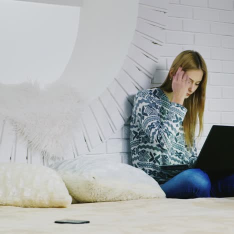 student using laptop at home