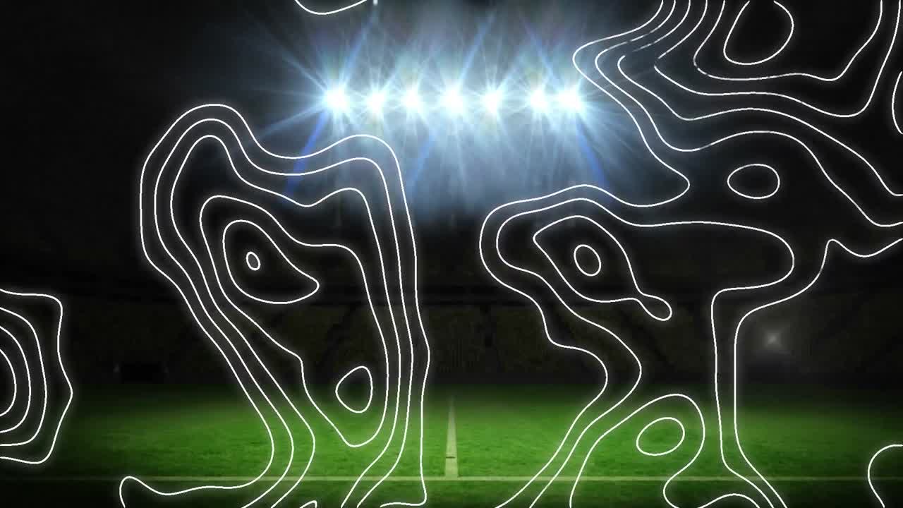 topografía contra contra las luces de inundación y el estadio deportivo en el fondo