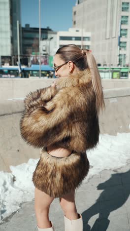 pretty woman posing showing her winter outfit look at ddp in seoul at winter - vertical