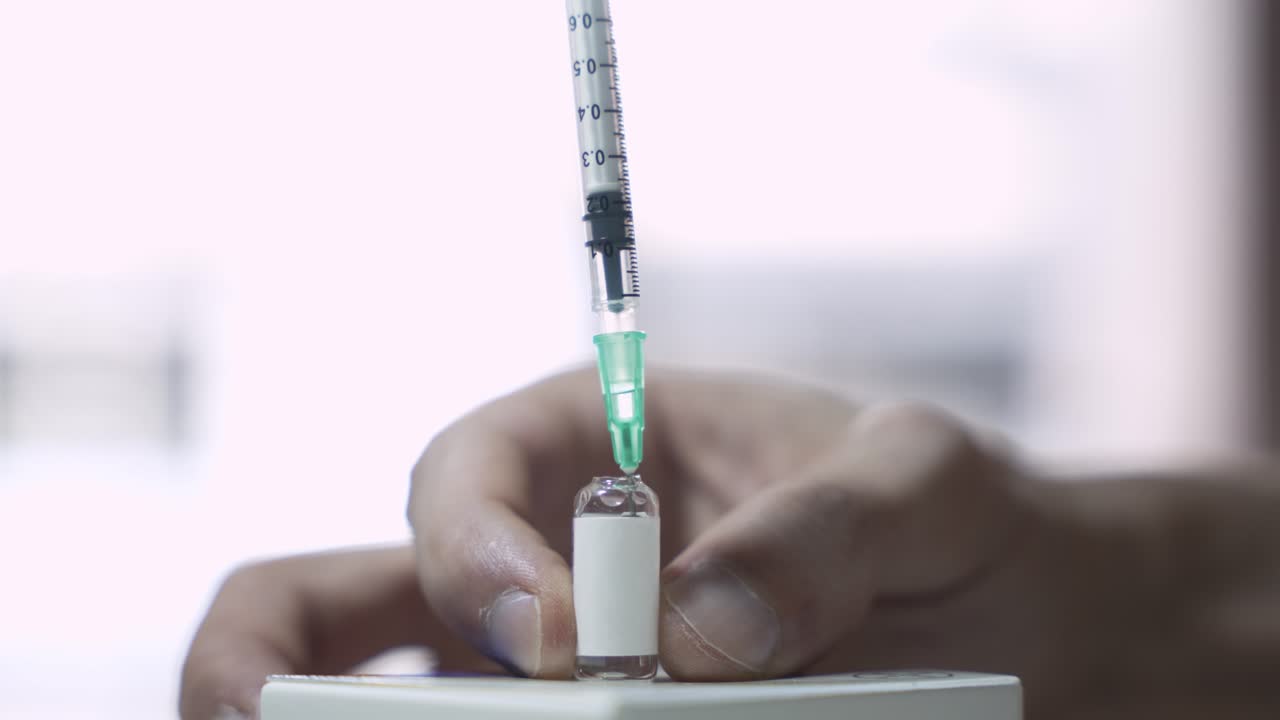 Syringe Drawing Medicine from Glass Ampoule, Injectable Medicine Concept