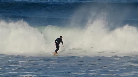 slow motion of huge carving at the most famous surf spot on the portuguese coast, guincho, cascais