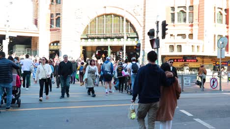 pedestrians crossing at flinders street station