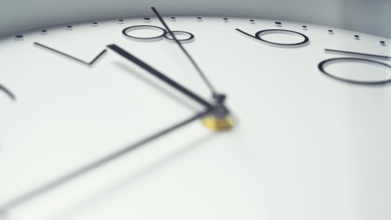 White wall clock, close-up. The camera follows the second hand. Time concept.