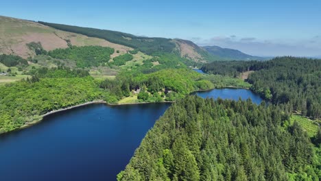 aerial shot of loch ard and forrest in the loch lomond and trossachs national park, scottish highlands, scotland on sunny summers day