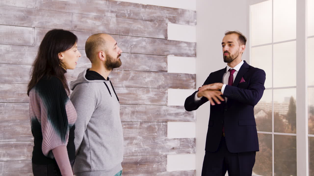 Real Estate Agent Giving Property Tour to Couple