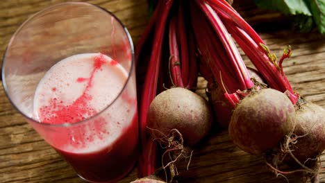 Radish-with-radish-juice-on-wooden-table-4k