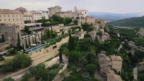 aerial view of ancient village of gordes in france on top of hill