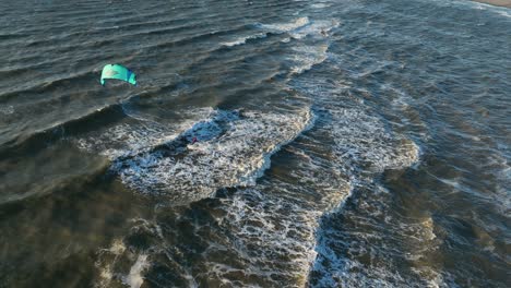 Wide-shot-of-a-kitesurfer-playing-in-the